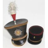 A French police hat and a theatrical Les Miserables hat.
