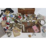 A wooden box, the top carved 'Germany 1940' with various WWII badges and medals and a silver