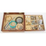 A wooden jewellery box containing mainly vintage costume jewellery.