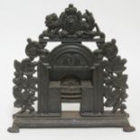 A Victorian cast iron miniature fireplace display model, height 33cm.