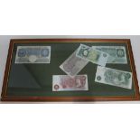 A group of six framed Bank of England bank notes.