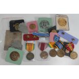 A quantity of mainly American military badges (some reproductions).