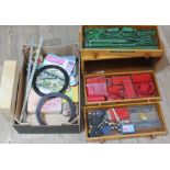 A three drawer wooden cabinet containing various Meccano and another box of Meccano parts.