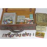 A case and contents including Golden Shred Golly badges, cigarette case etc.