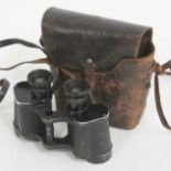 A pair of German WWII binoculars marked 'Dienstglas 6x30 258270 ddx', with leather case.