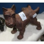 A cast metal scottie dog with cocked leg, length 18cm, height 15.5cm.