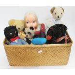 A basket of vintage soft toys.