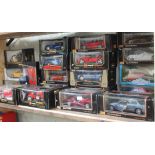 A collection of 20 boxed Burago, Maisto & MCT 1:18 & 1:16 scale die cast model vehicles and a