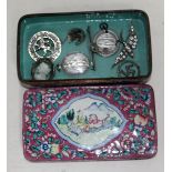An enamel tin containing silver and other costume jewellery.