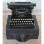 A Corona portable typewriter with case.