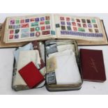 A world stamp album, 19th century and later, together with a tin of loose stamps and a friendship