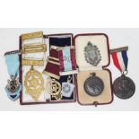 A mixed lot comprising Masonic jewels including one hallmarked silver gilt, another marked '
