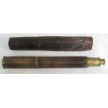 A single drawer woven bound brass telescope with leather case.