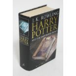 A first edition hardback copy of Harry Potter and the Half Blood Prince with printing error on