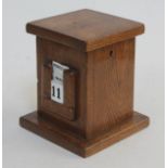 An oak lockable calendar box, height 16cm, (no key).