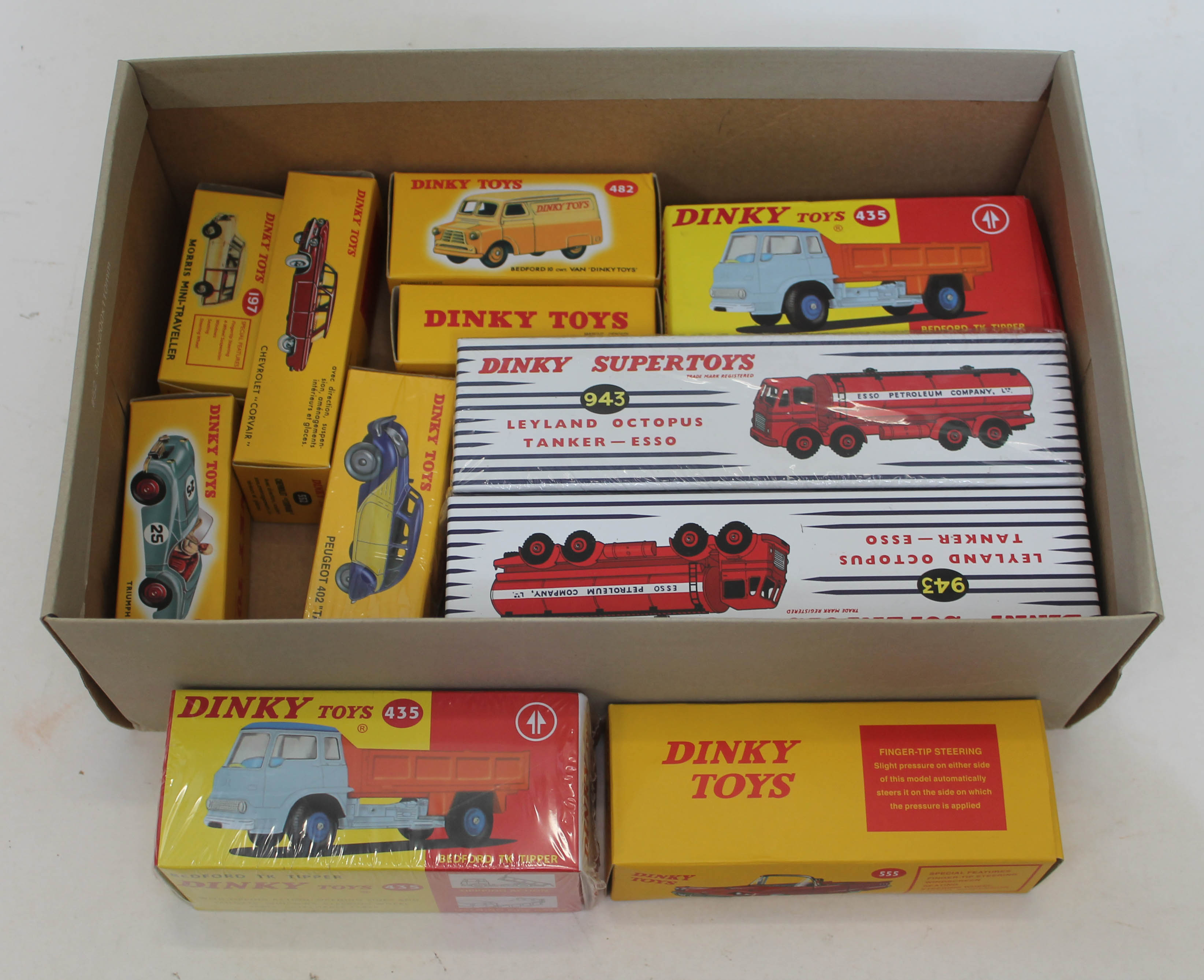 A collection of 10 Reproduction boxed Dinky model vehicles and an Esso pump station.