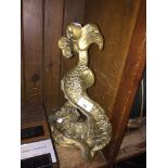A brass serpentine door stop Catalogue only, live bidding available via our website. If you