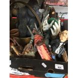 A box of misc figures, ornaments, brass jam pan, etc. Catalogue only, live bidding available via our