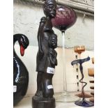 An African carved figure Catalogue only, live bidding available via our website. If you require P&