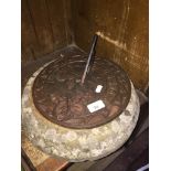 A cast sundial on stone base inscribed "In loving memory" Catalogue only, live bidding available via