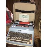 A cased Olivetti Lettera 32 portable typewriter Catalogue only, live bidding available via our