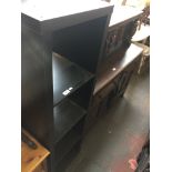 A modern black open shelving unit Catalogue only, live bidding available via our website. If you