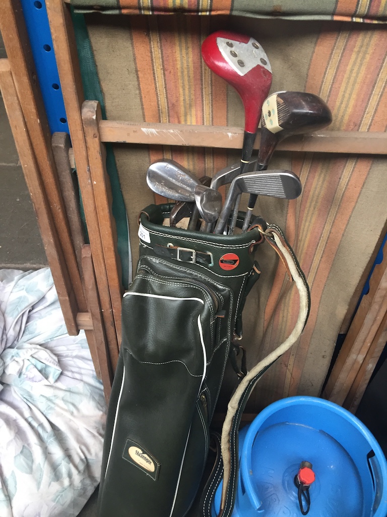 A golf bag with clubs Catalogue only, live bidding available via our website. If you require P&P
