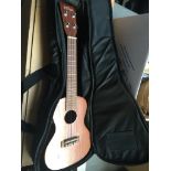 A Vintage VUC 60EA electro ukulele in Stagg soft case Catalogue only, live bidding available via our