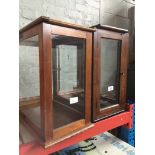 Two glazed cases Catalogue only, live bidding available via our website. If you require P&P please