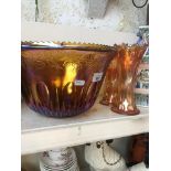 A large carnival glass bowl and a pair of carnival glass vases Catalogue only, live bidding