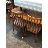 A G-Plan teak extending dining table and six chairs Catalogue only, live bidding available via our
