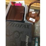 A Filofax in original box, and a rosewood pocket watch stand Catalogue only, live bidding