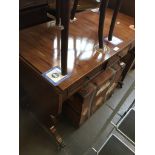 An early 20th century mahogany cross banded sofa table with brass castors Catalogue only, live