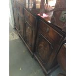 A Reprodux Georgian style mahogany breakfront sideboard Catalogue only, live bidding available via