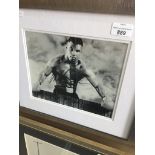 A signed photograph of Mike Tyson with certificate of authenticity to rear, 20cm x 24cm, framed