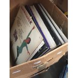 A box of LP and 12" single records Catalogue only, live bidding available via our website. If you