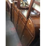 A mahogany buffet sideboard with curved deco style ends Catalogue only, live bidding available via