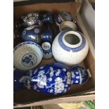 A box of blue and white oriental style pottery Catalogue only, live bidding available via our