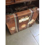 A vintage leather travel case with vintage labels - no key Catalogue only, live bidding available