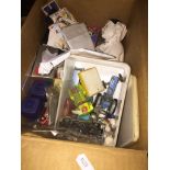 A small box of bric a brac including playworn die cast model vehicles, loose stamps, etc Catalogue