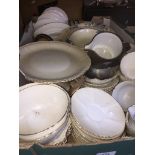 A box of misc pottery, cups, saucers, plates, etc. Catalogue only, live bidding available via our