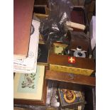 A box of assorted items to include magazines on Belgium, pictures, old cameras, vintage first aid