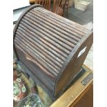 A wooden letter rack with roll top closure Catalogue only, live bidding available via our website.