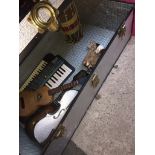 A vintage travel trunk and contents with musical instruments, etc Catalogue only, live bidding