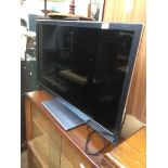 A Panasonic 37" LCD smart tv with 3D and wireless adaptor - with remote Catalogue only, live bidding