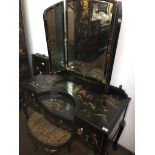 A black laquered and chinoiserie decorated dressing table with triple mirror and matching stool on