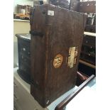 A vintage leather travel case with vintage labels - with key Catalogue only, live bidding