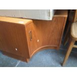 A G-Plan teak corner base cupboard Catalogue only, live bidding available via our website. If you