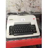 An Olympia typewriter. Catalogue only, live bidding available via our website. If you require P&P