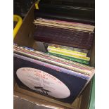 A box of books and LPs Catalogue only, live bidding available via our website. If you require P&P